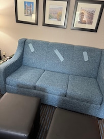 Sleeper sofa with ripped back cushions covered with tape☹️