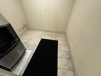 Stains on the wall. Dirty tile. Overall dirty appearance.