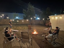 Firepit story time and Cornhole for the boys. Beautiful night with lights strung throughout the yard.