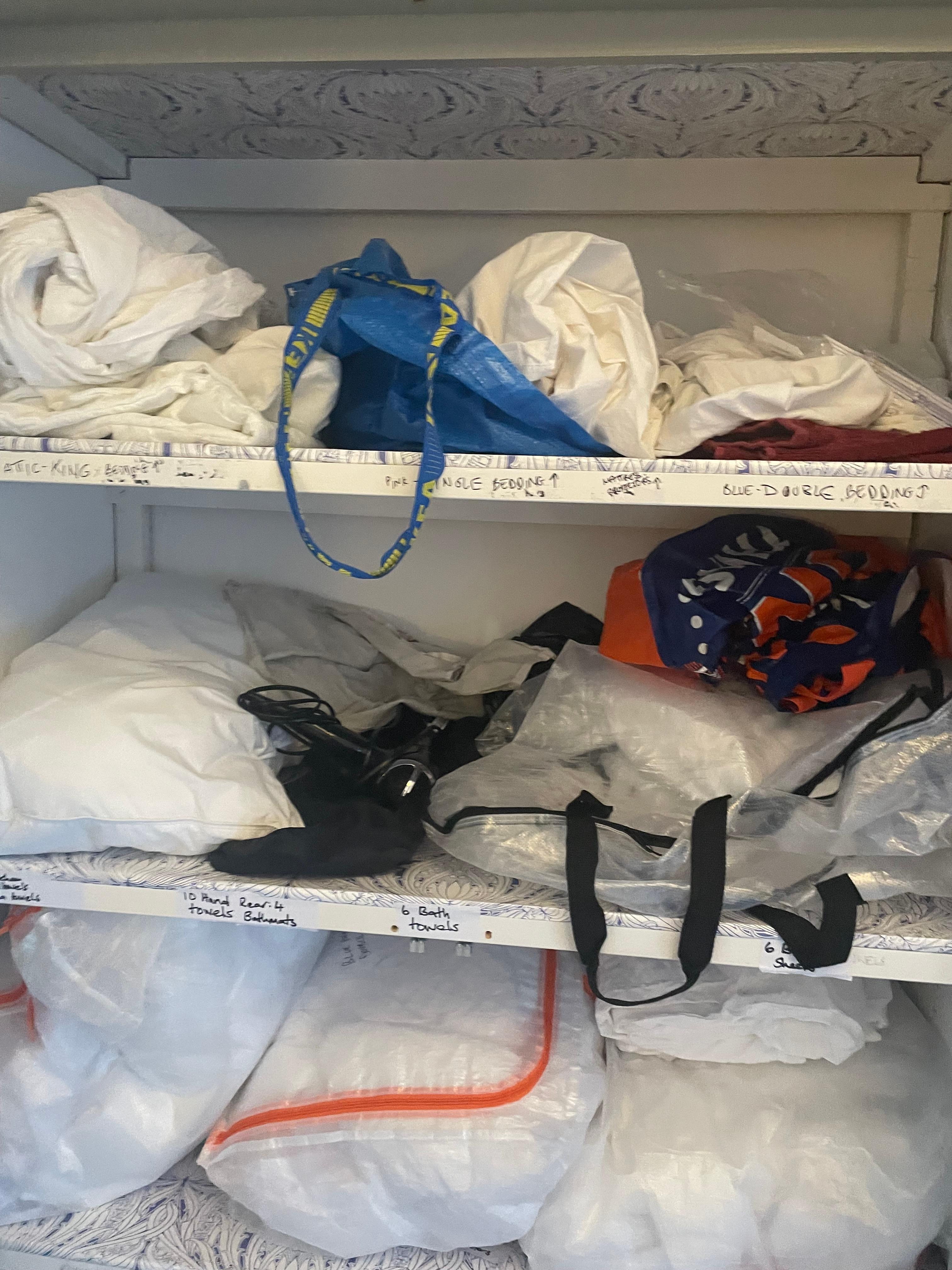 Cupboards full of un-ironed bedding 