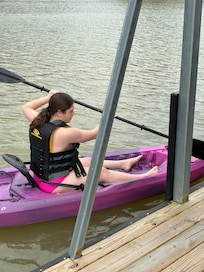 My granddaughter on the kayak .