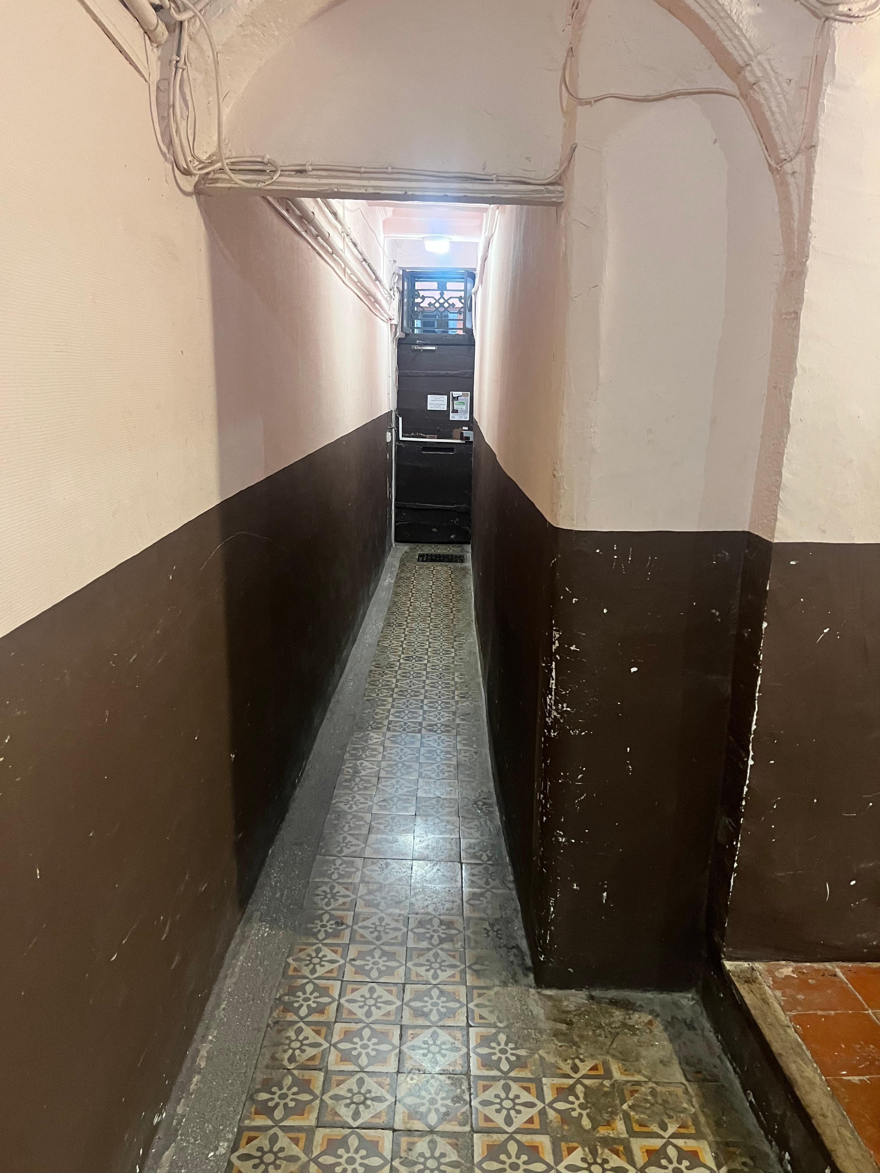 Super narrow hallway and door I the street