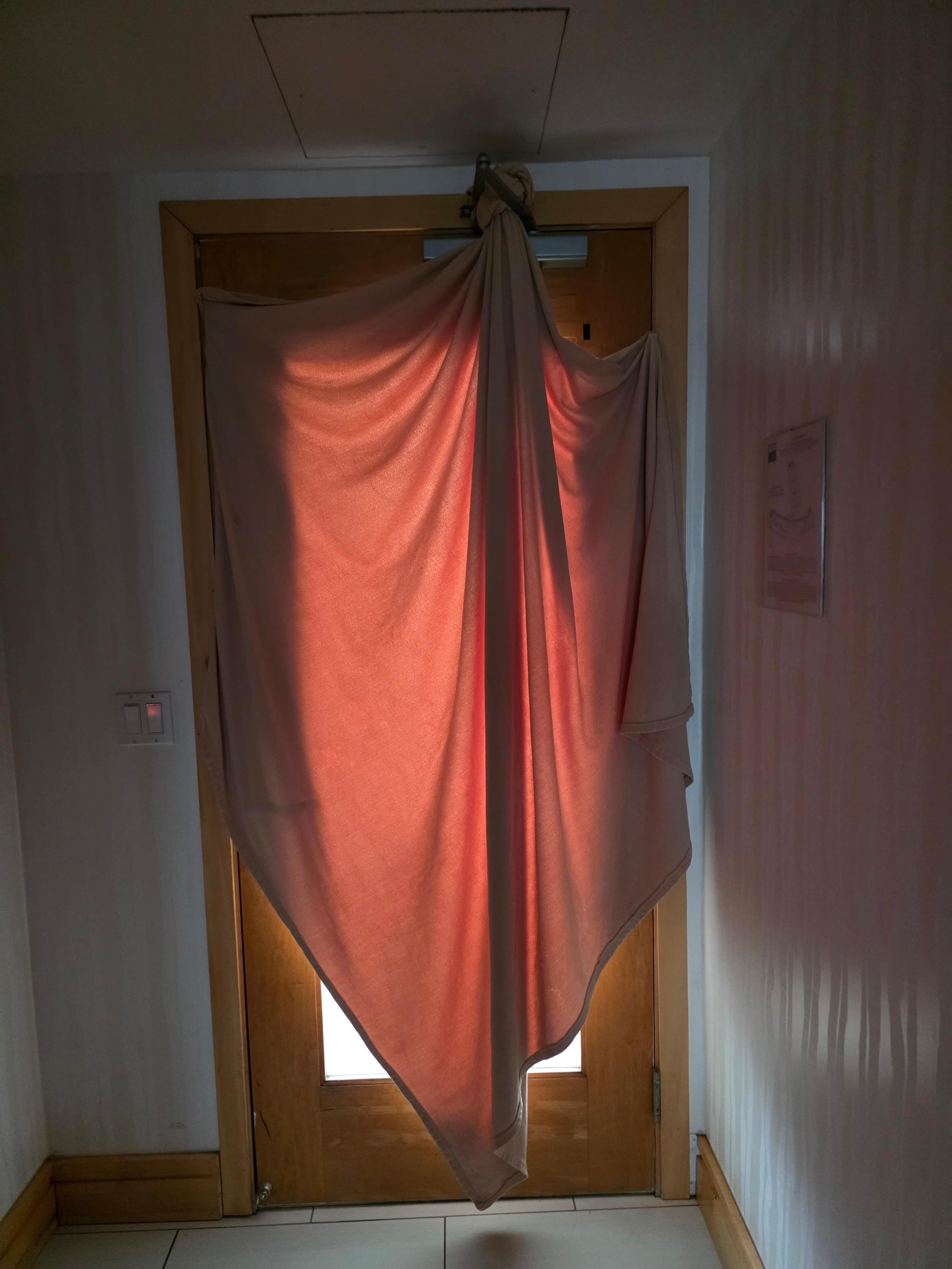 Extra blanket to keep hall lights out for sleeping. 
