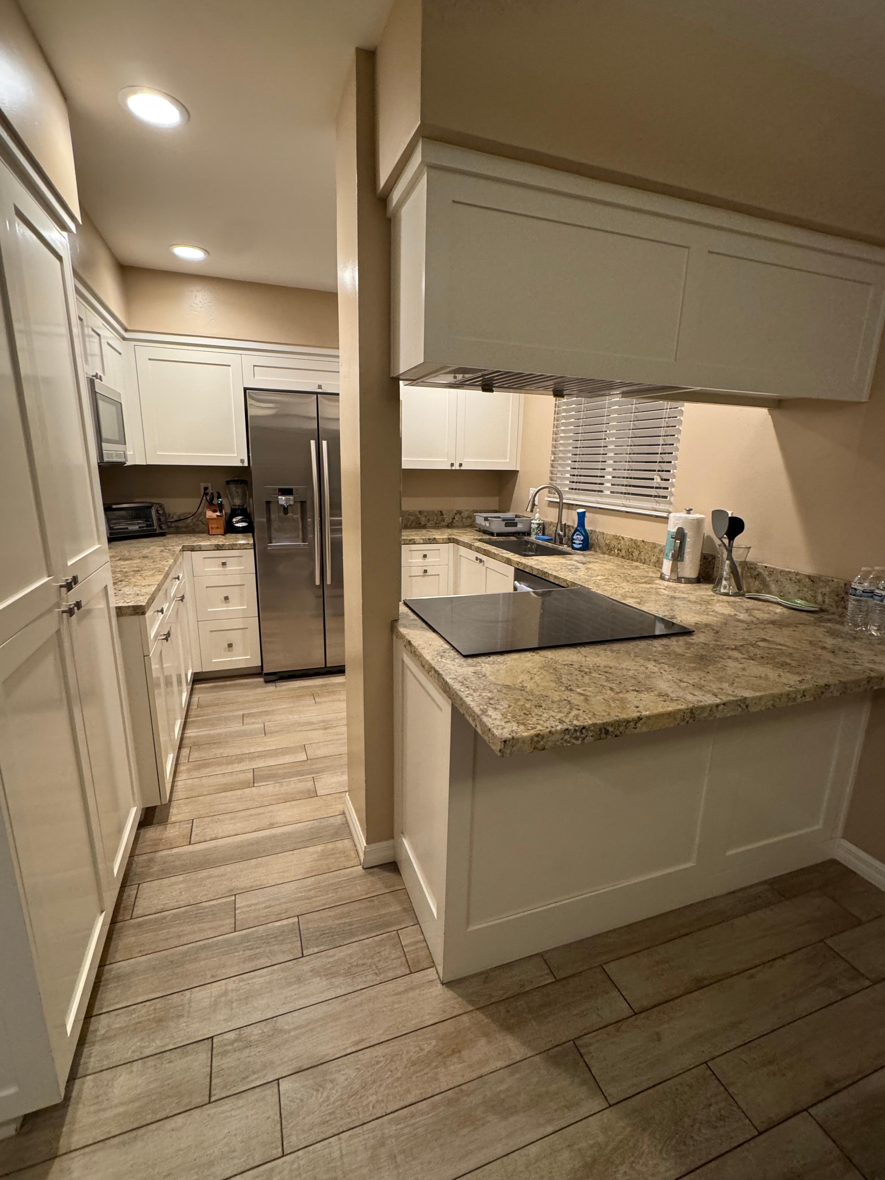 Fully equipped kitchen, beautiful granite, new shaker cabinets, deep pantry, new modern stainless-steel appliances, huge basin sink, great peninsula bar— kitchen is larger than it seems! 