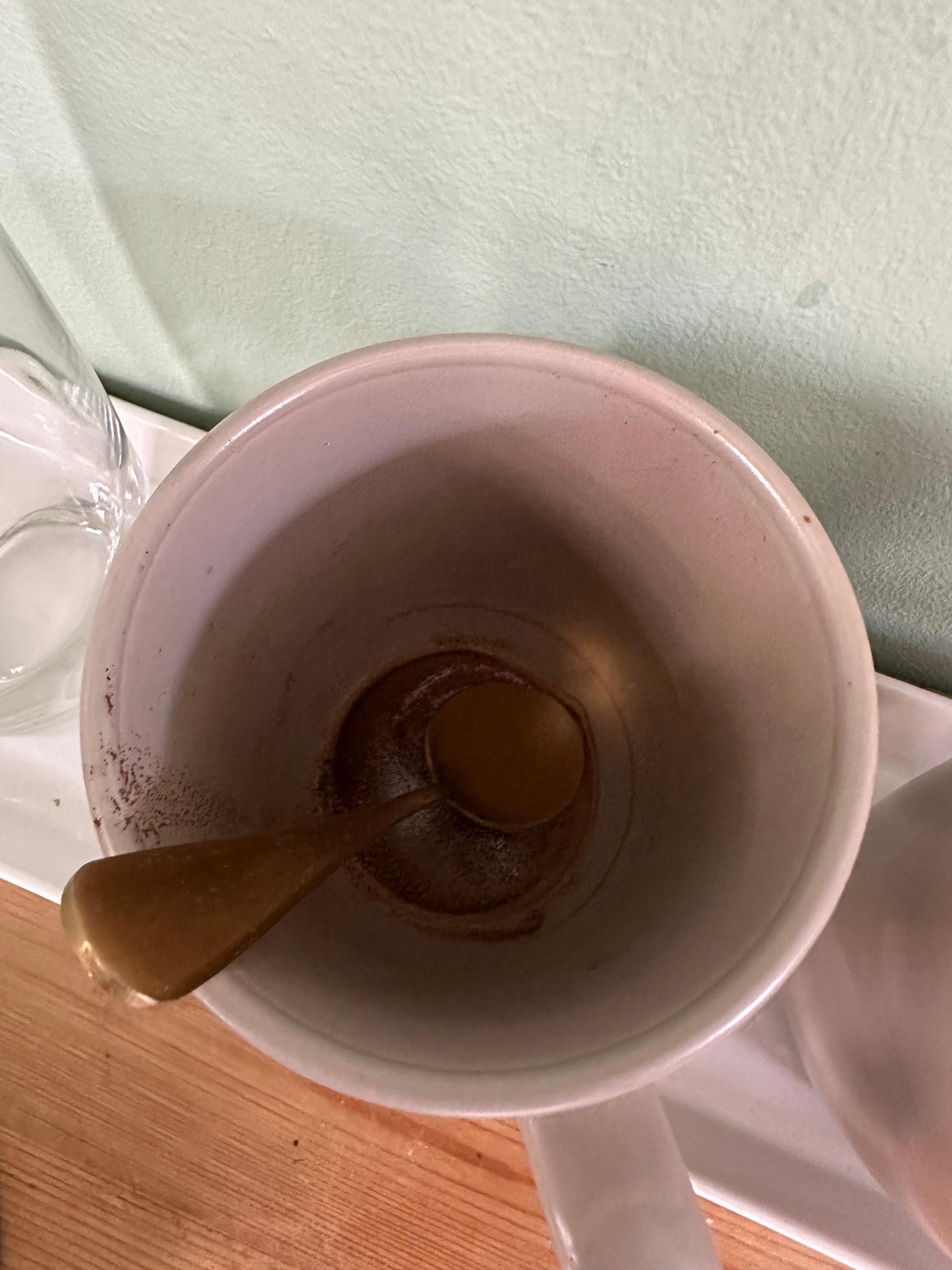 Dirty coffee cups still had dried coffee