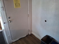 Hole in wall from door. Adjacent room also had the same and you could look thru into the other room.