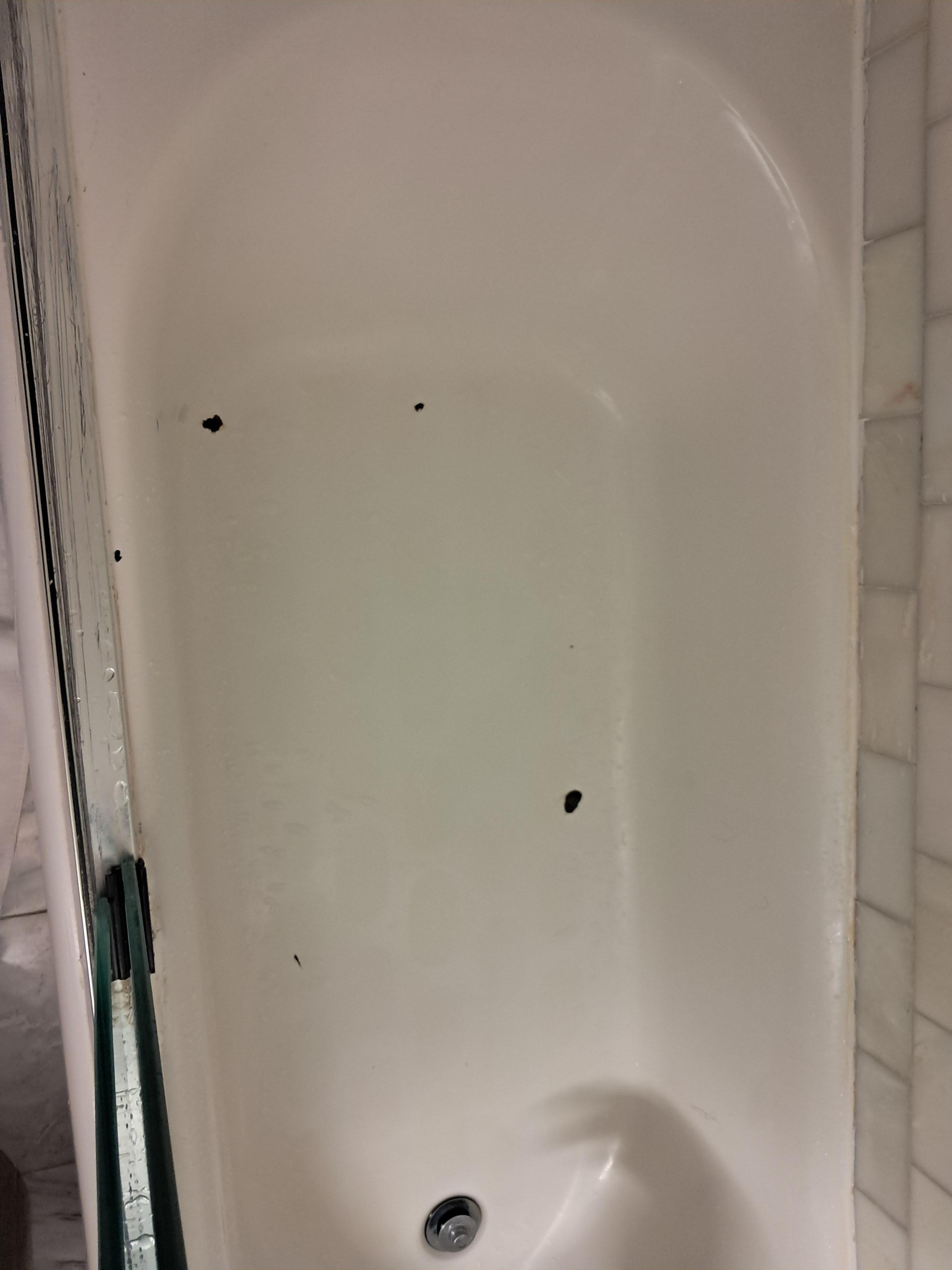 Chips in the porcelain bath tub 