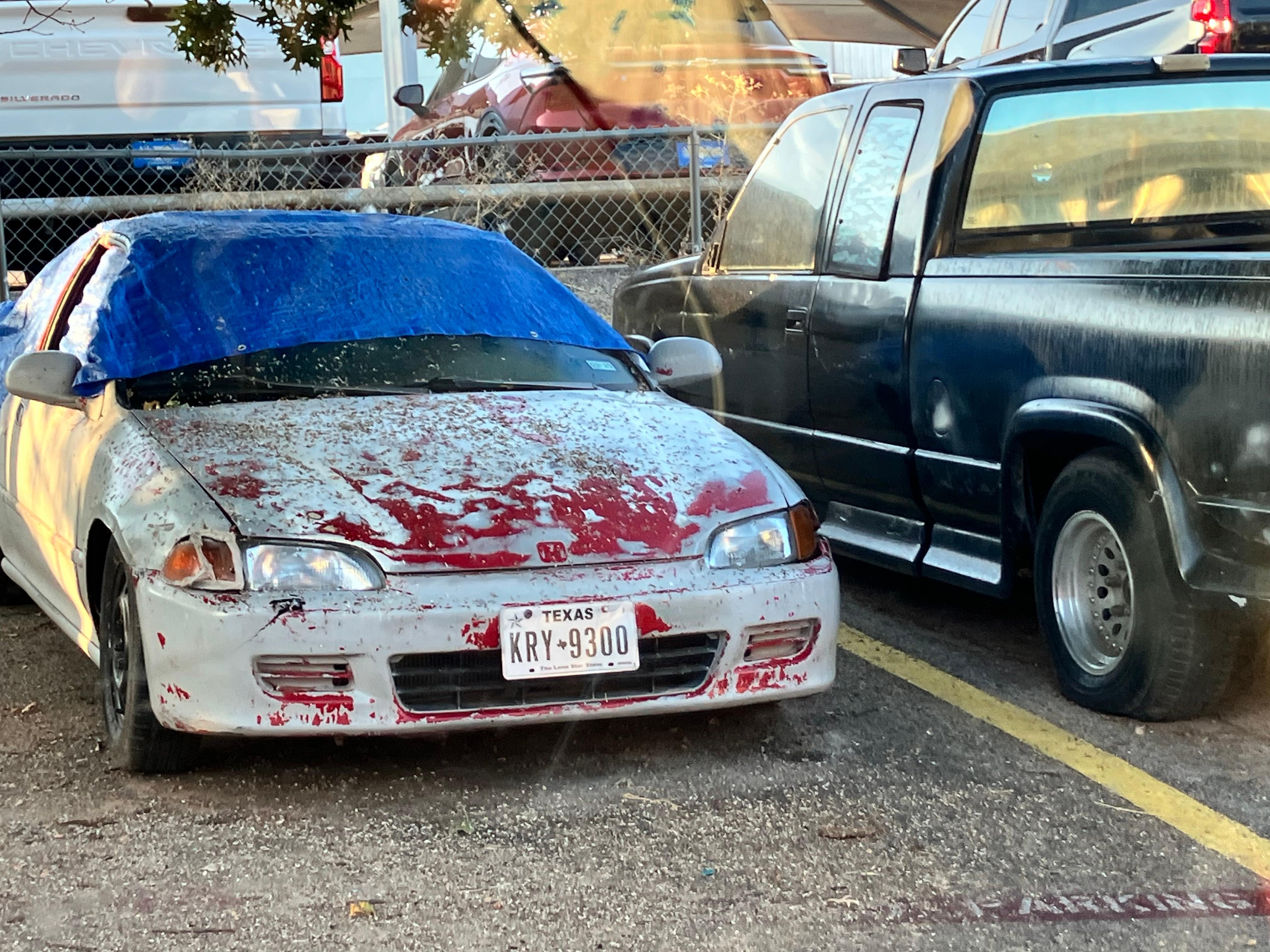 Junk autos in parking lot
