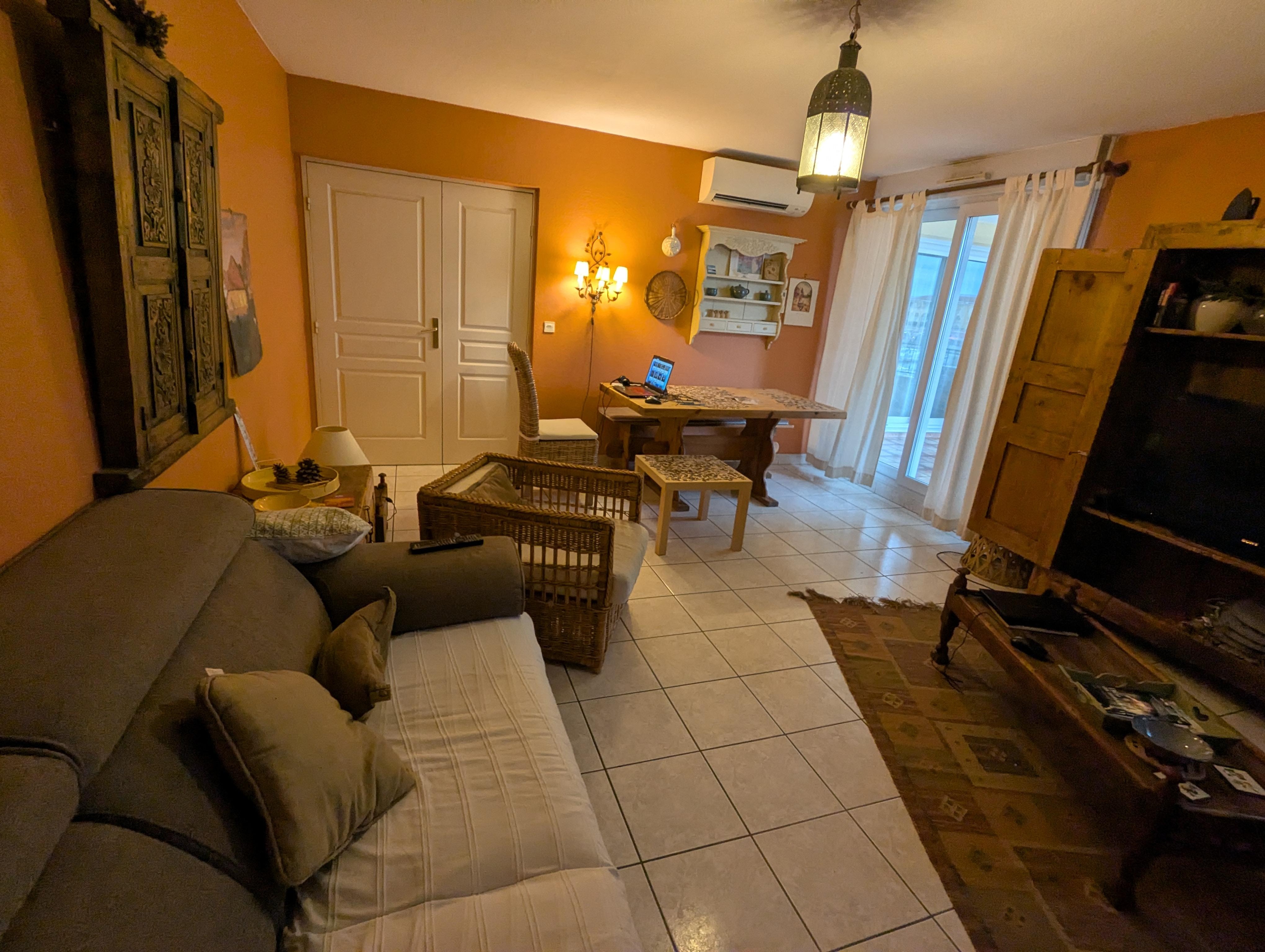 The dining/living room space (it's larger than what is shown here). This is an incredibly comfortable space and our favorite room. The table has plenty of seating (not shown here because we moved chairs away to use the table for jigsaw puzzles).