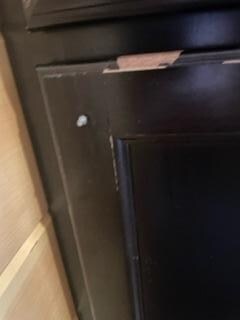 Missing cabinet knob in the bathroom.