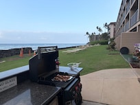 BBQ grills on ocean side.