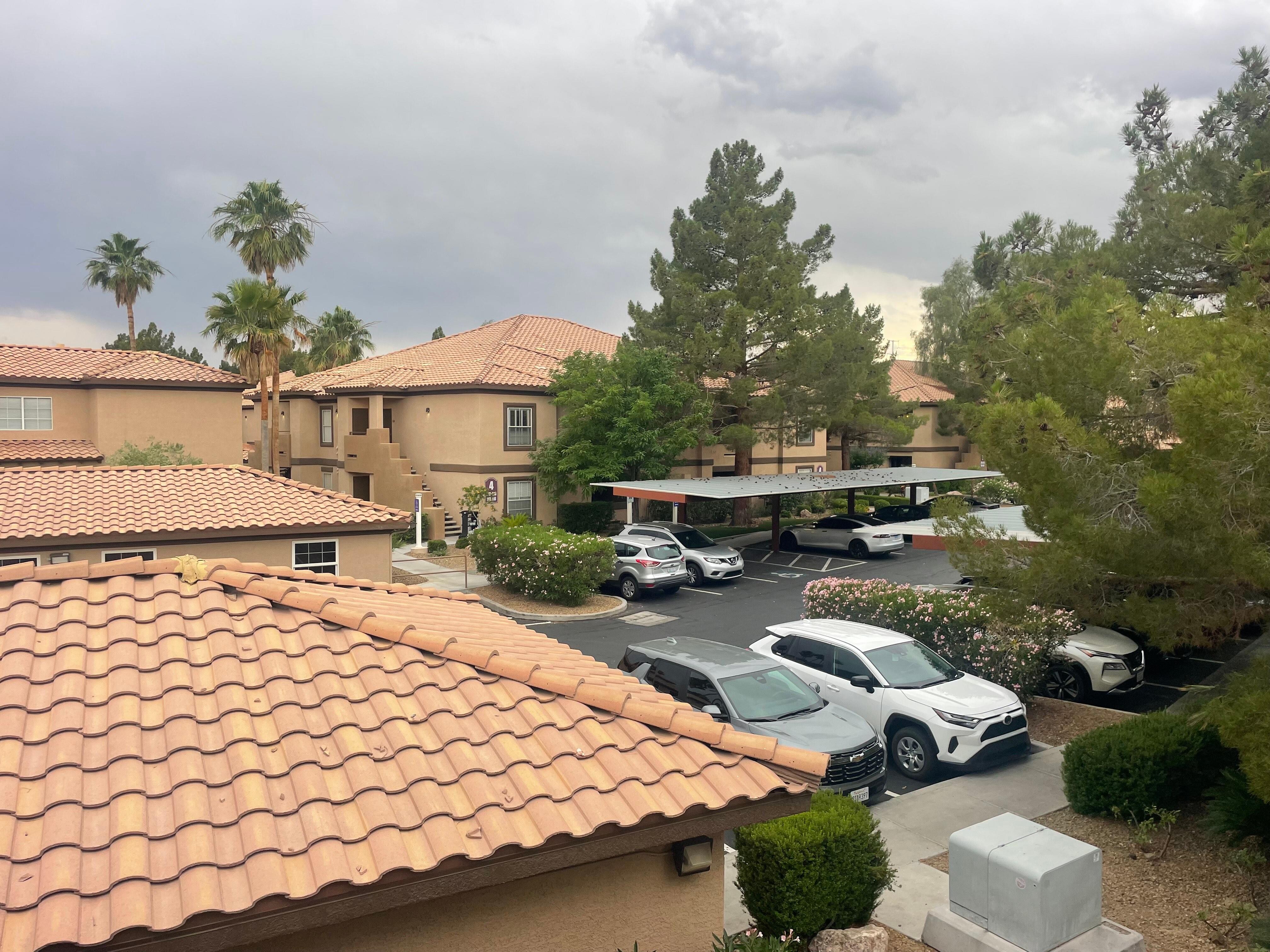 View of parking lot from your balcony complete with a 4 seat dinning set