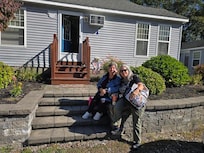 My sister and I in front of the cottage.