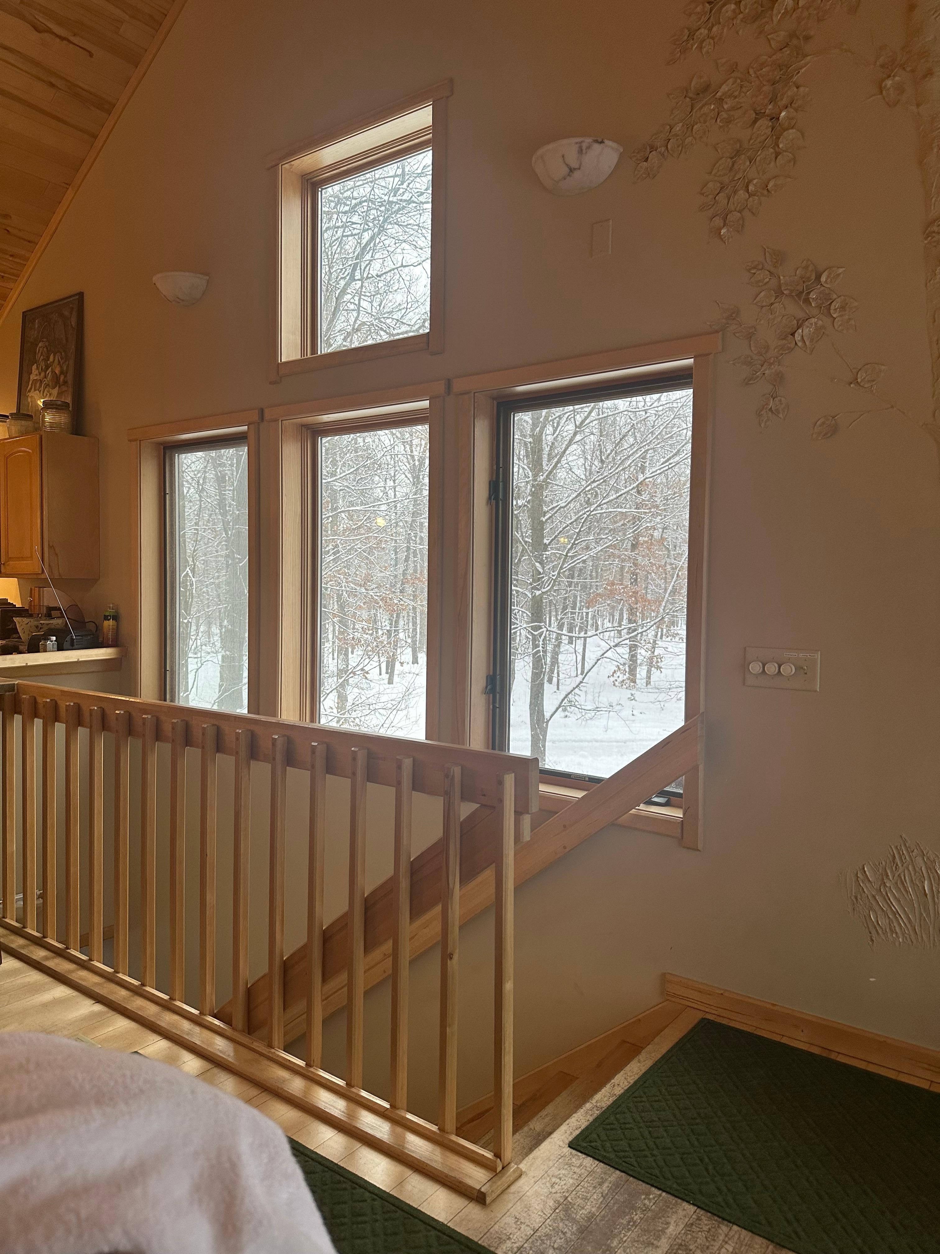 A snowy view off the side of the cabin. 
