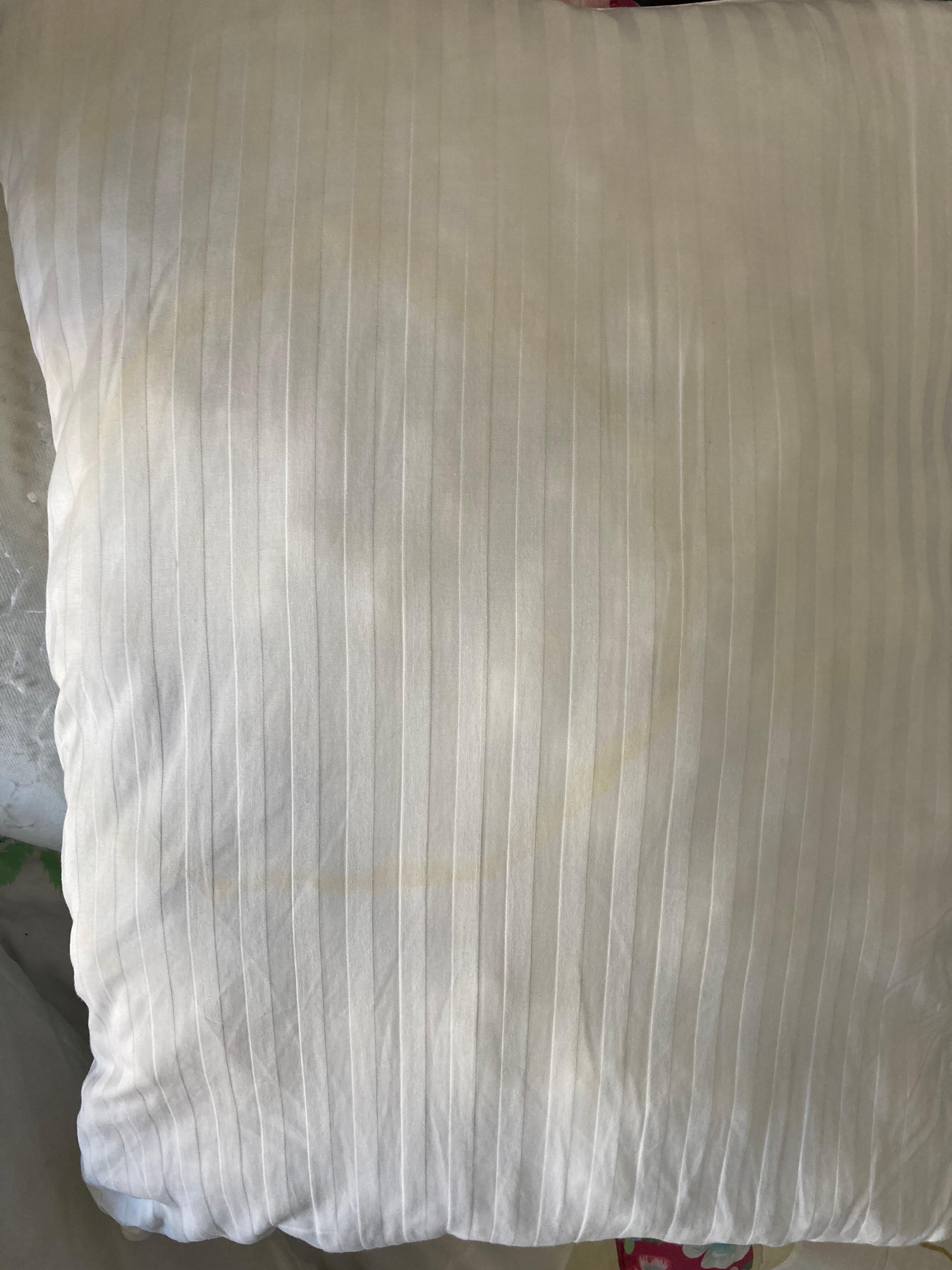 Yellow stains in unprotected pillows.