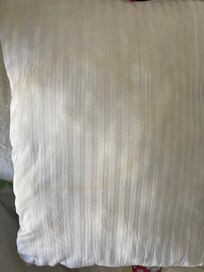 Yellow stains in unprotected pillows.