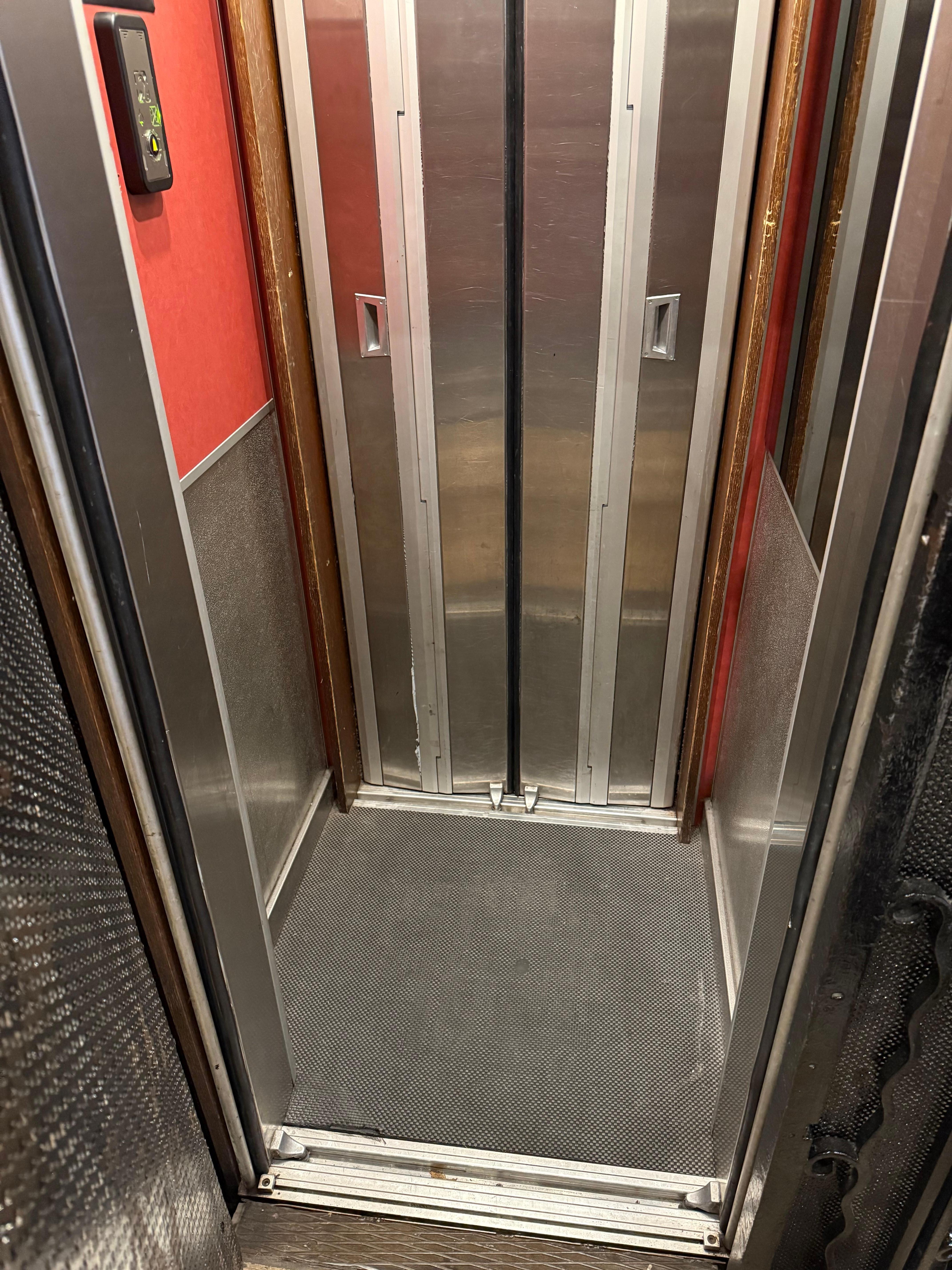 Inside of elevator big enough for two people if you’re chummy. 