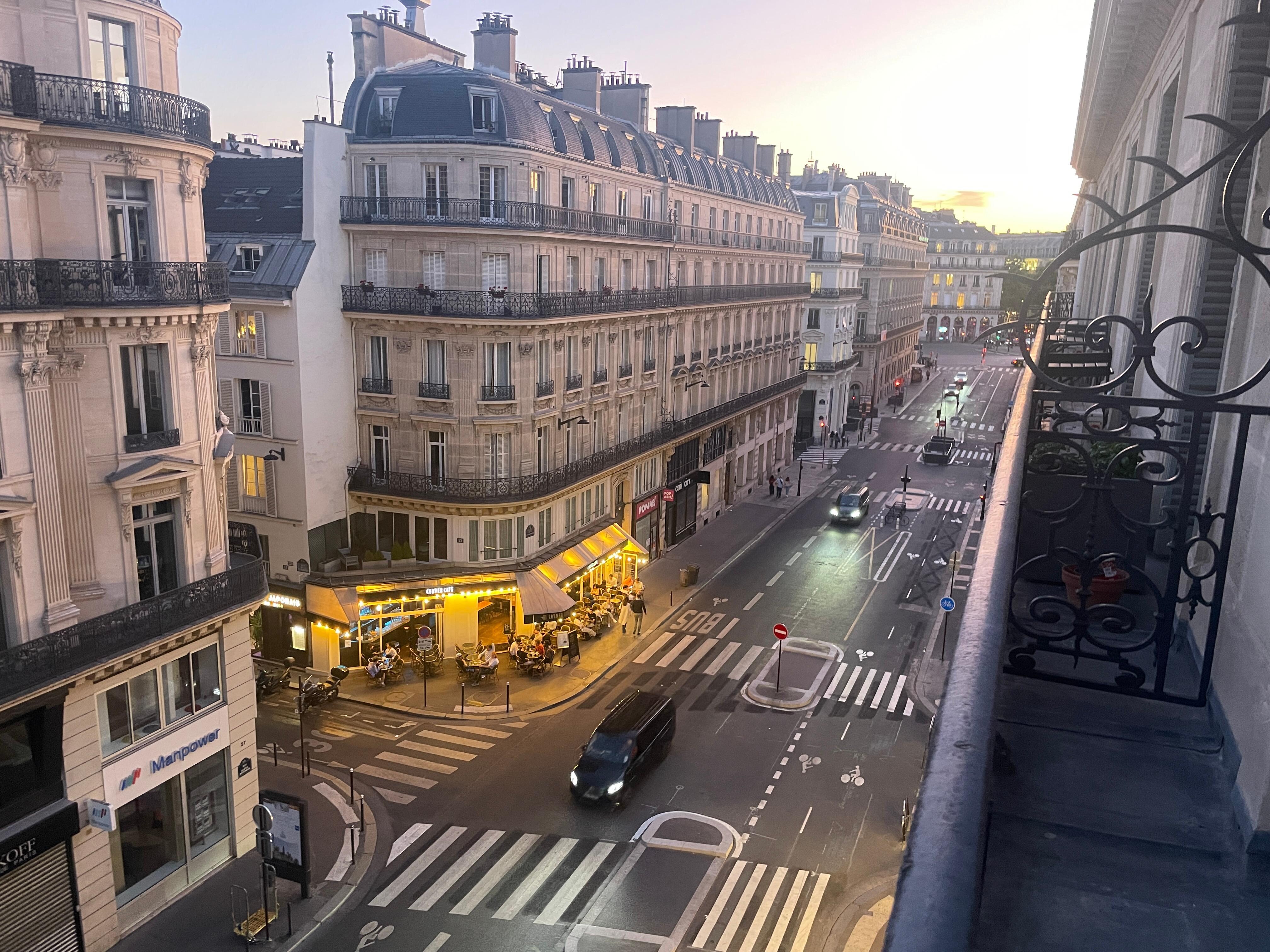 View of a glowing corner cafe from the window 