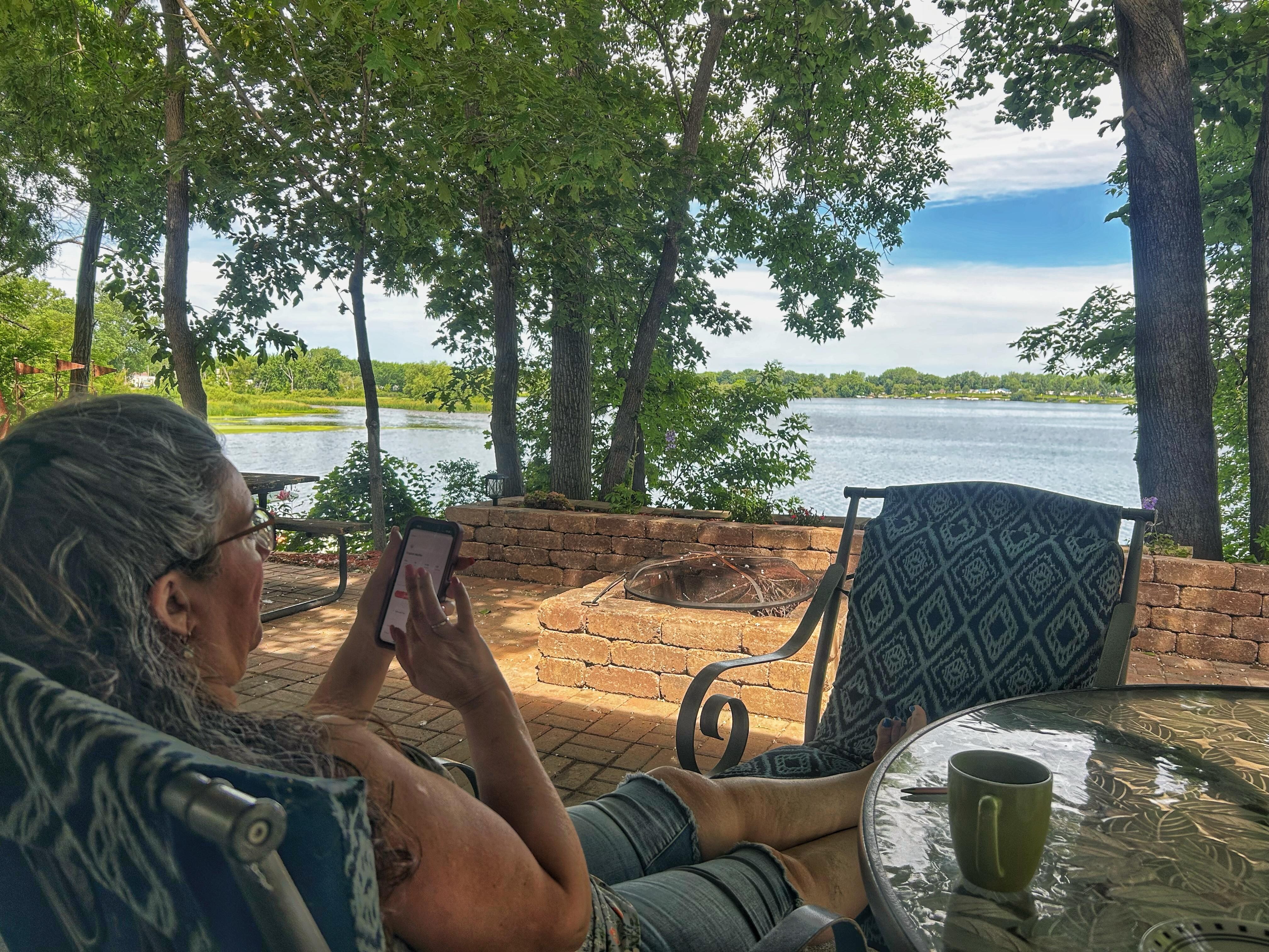Morning coffee by the lake.  The overhang keeps the outdoor furniture dry - much appreciated.