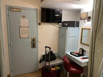 Room has a small mini-fridge with complementary water.