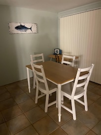 Kitchen area off a laundry room with a small bathroom. The pool deck is directly off there.