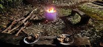 Camp-fire dinner, cooked to perfection and the lively hum of the rainforest to make the atmosphere.