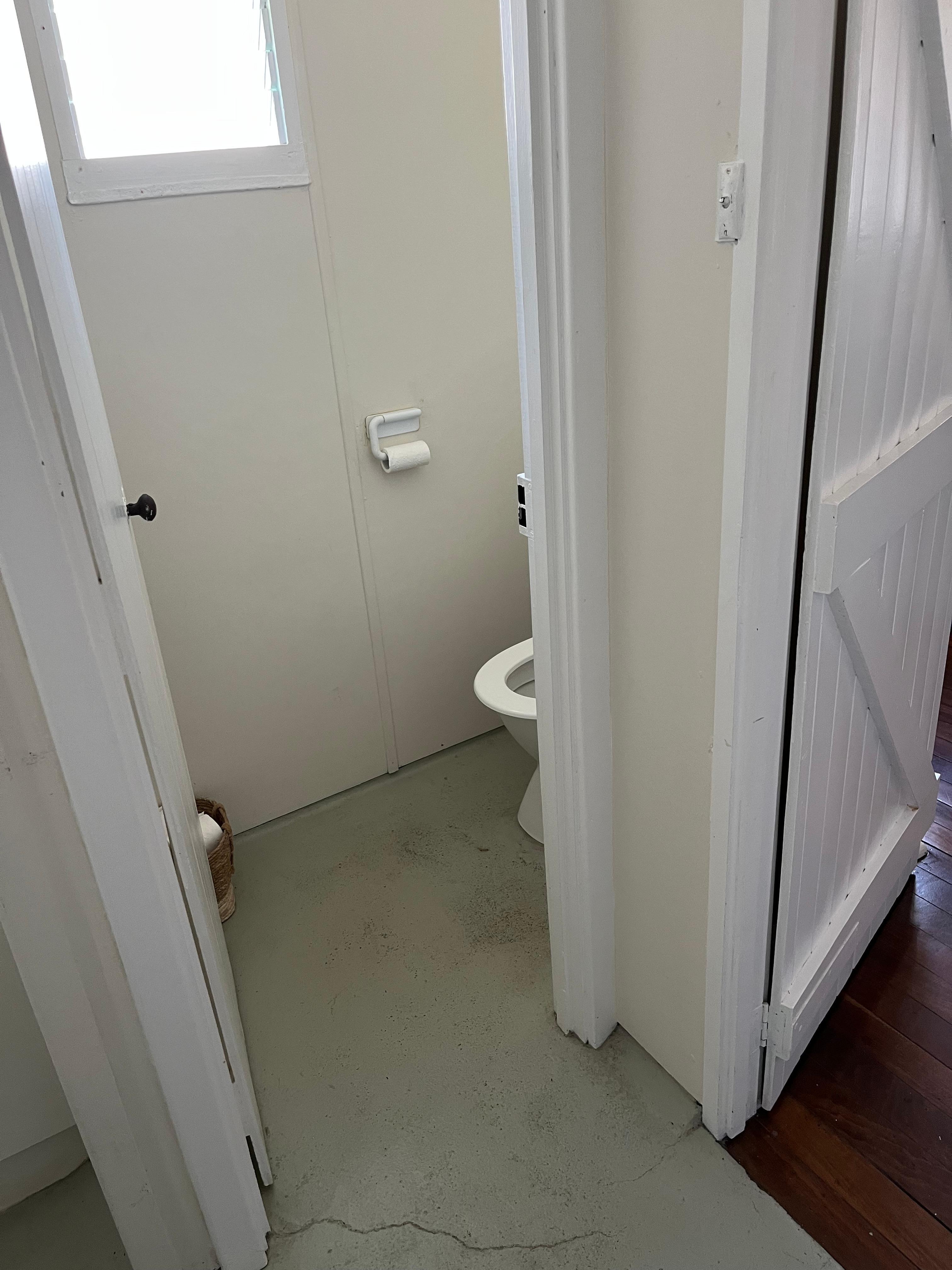 The toilet room (still part of the original house) which did not seem to have proper oder removal/ventilation.