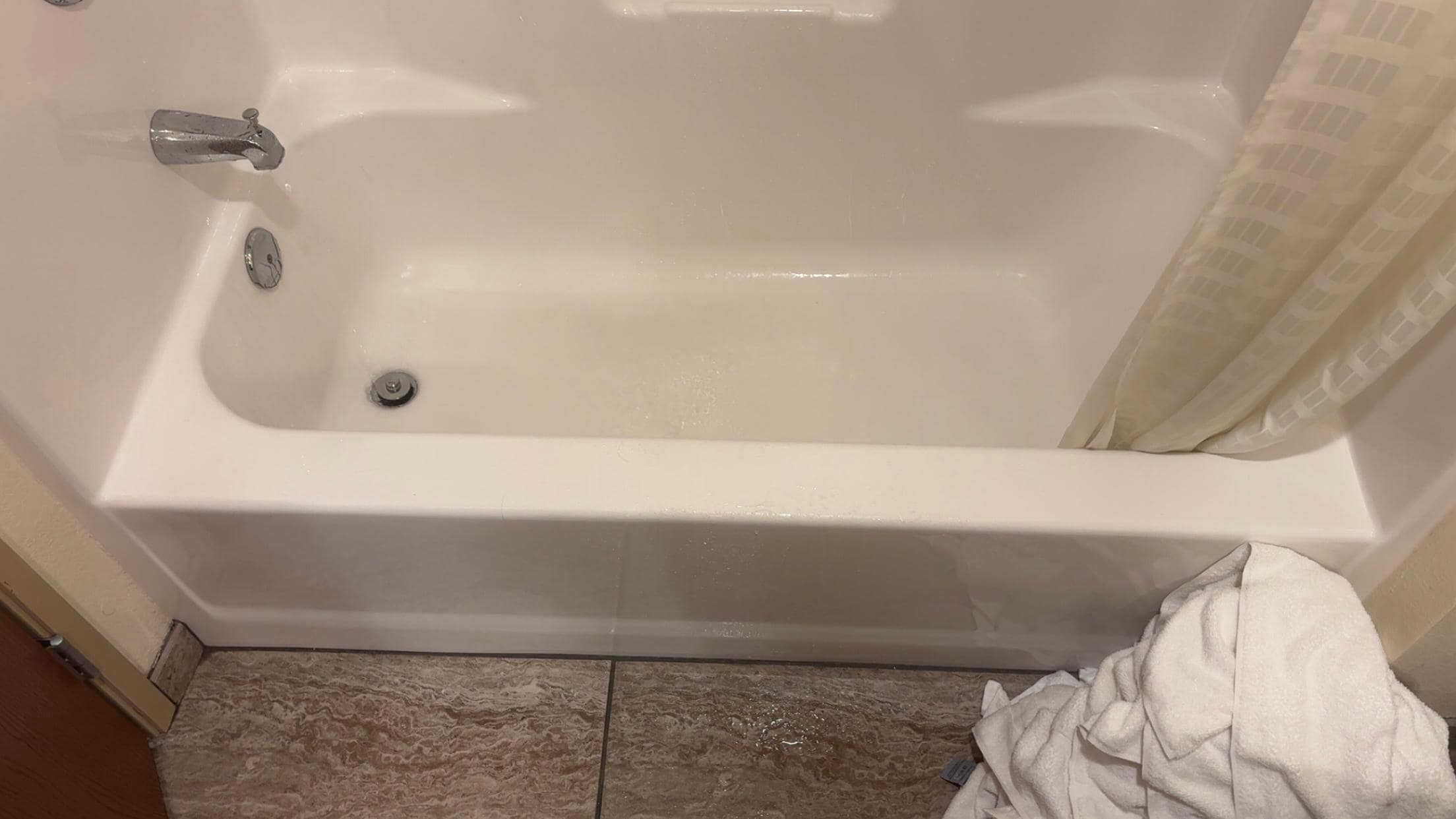 Soaked floor and used towels after 2 showers. Won’t let me add the shower video but I want to add the removed shower head picture. For $170 a night this is the worst shower condition ever.