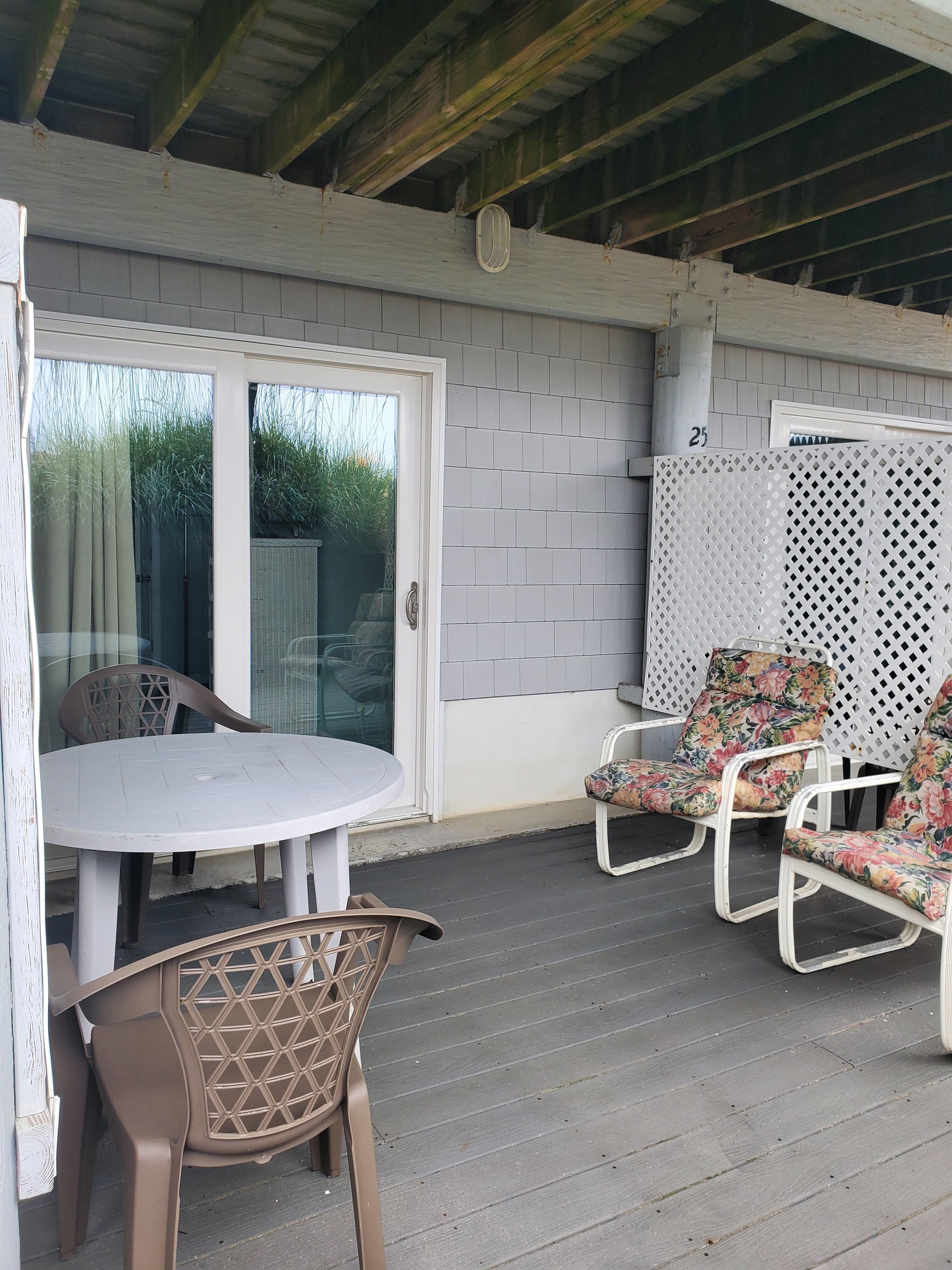 Beach side room. Private sitting area with chairs and table