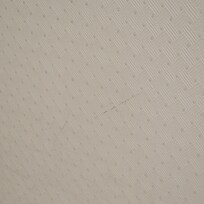 Shoe scuffs on wall beside bed