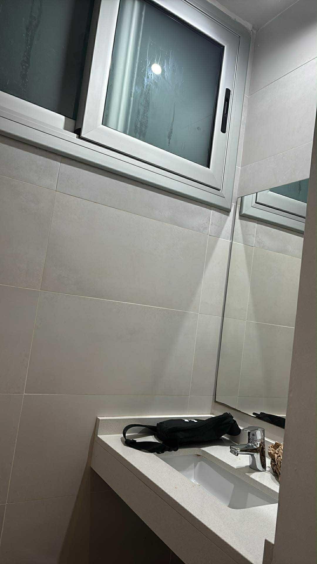 Sink and window to shaft which included another window for nabour as well as other floors