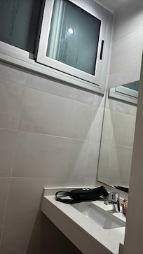 Sink and window to shaft which included another window for nabour as well as other floors