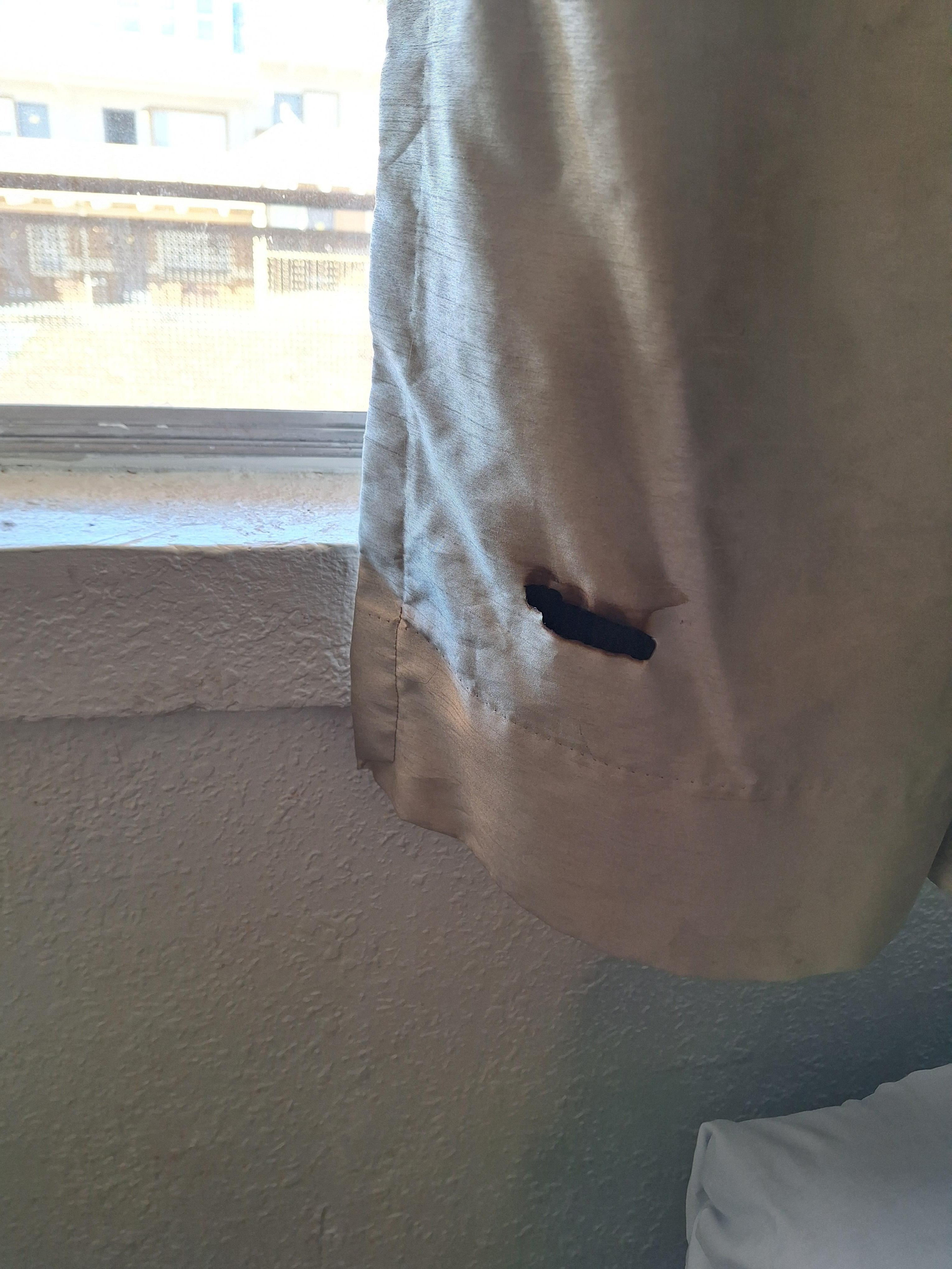 Burnt curtains. No pillowcases. Dirty towels. 