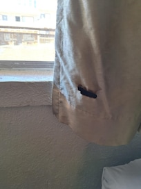 Burnt curtains. No pillowcases. Dirty towels.