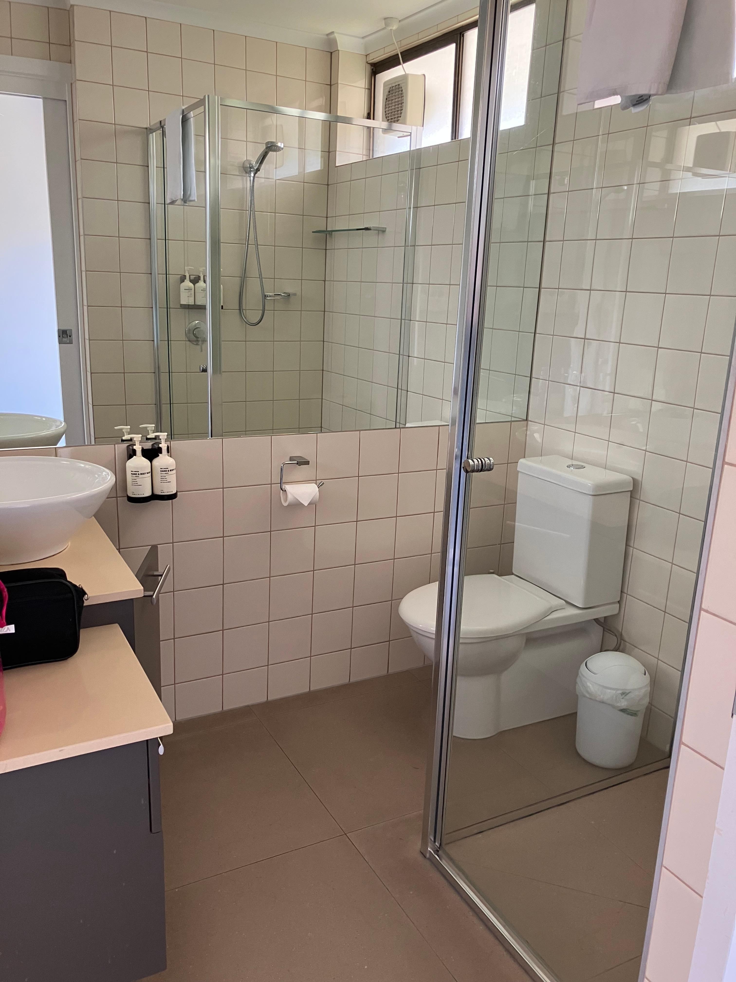 Bathroom had big shower, basin and space for toiletries.