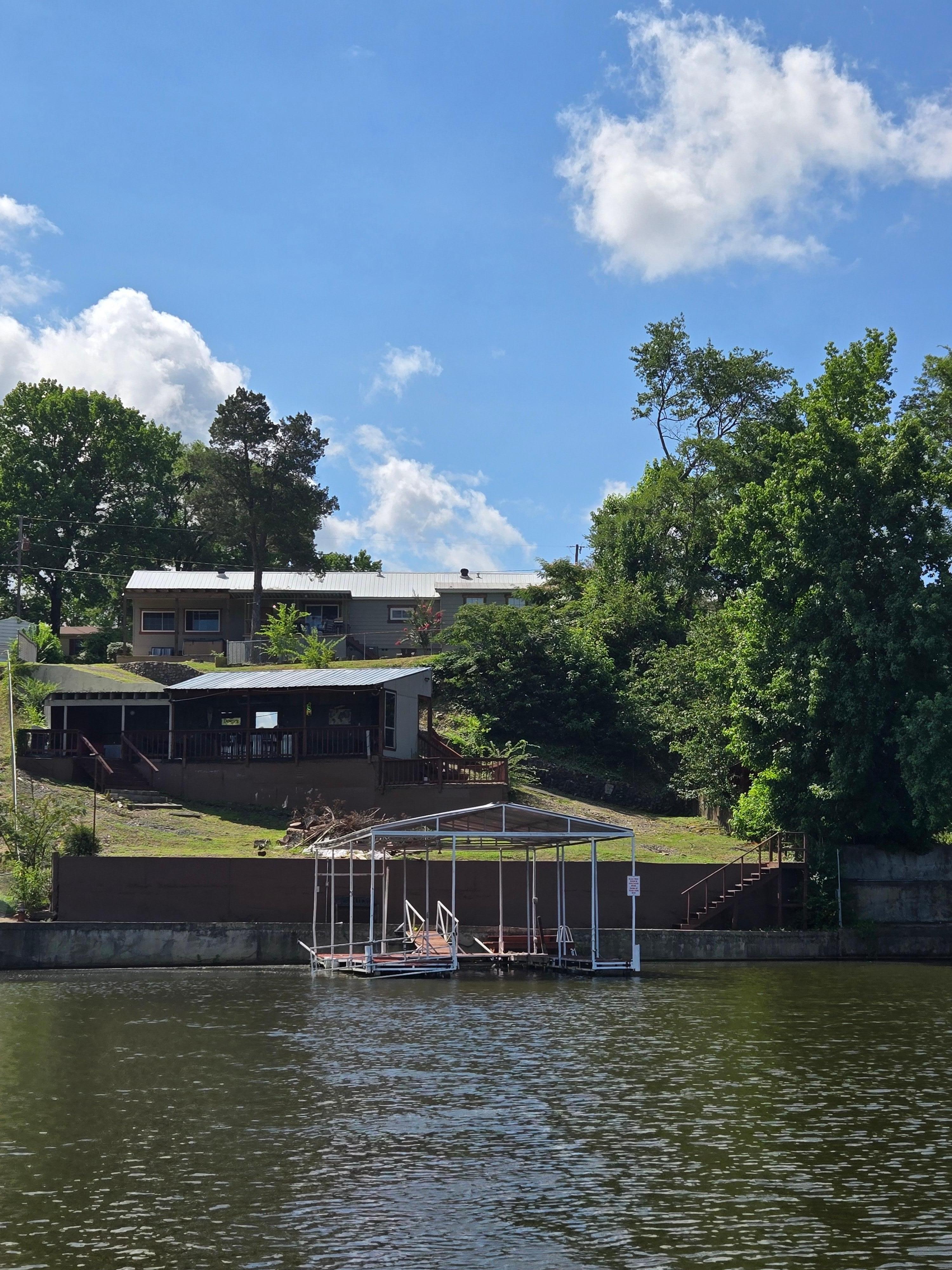 As you can see from the water, the hill is steep and there is some yard debris.