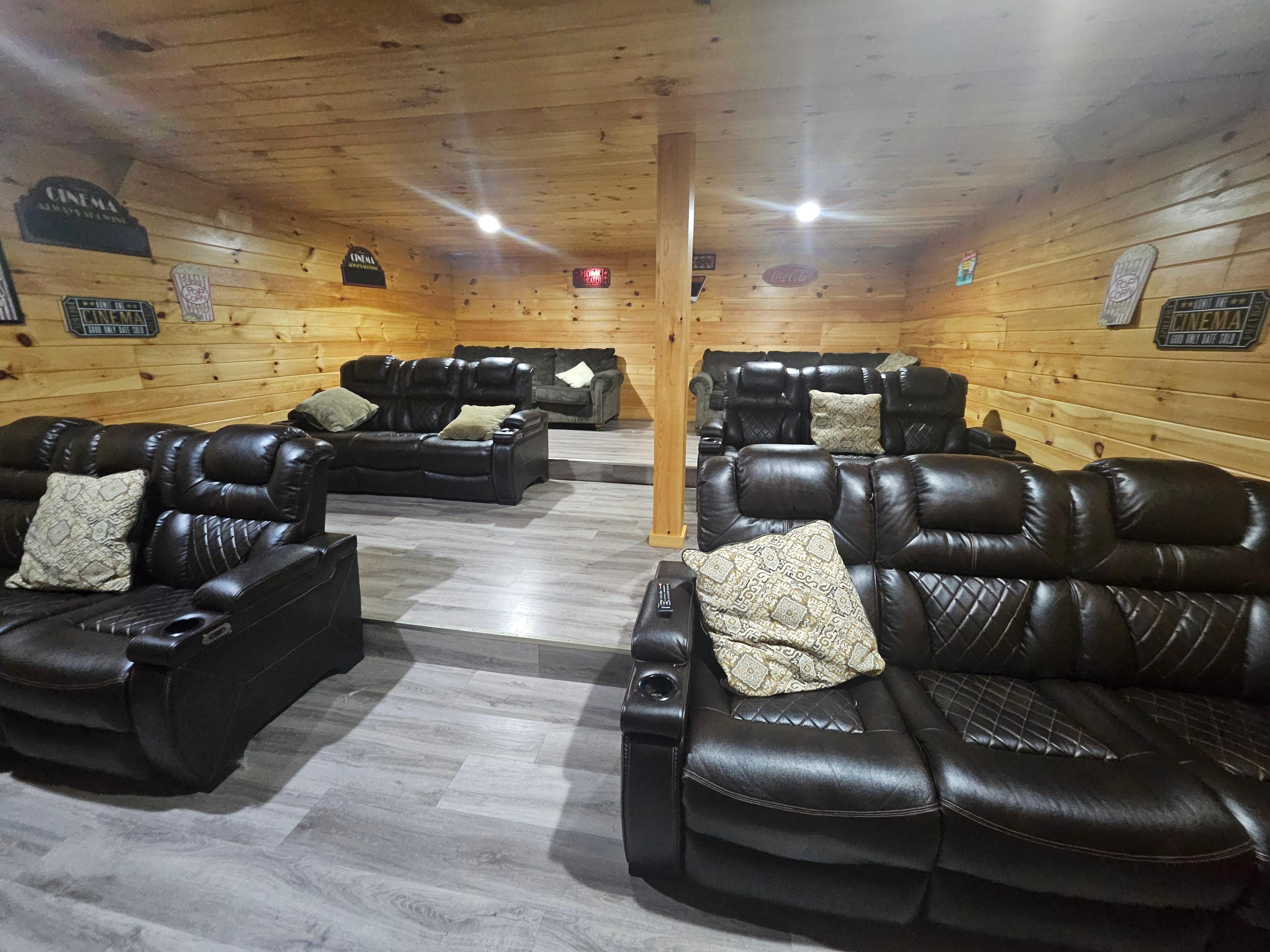 The theater room has 3 rows and the back row has pull out sofas