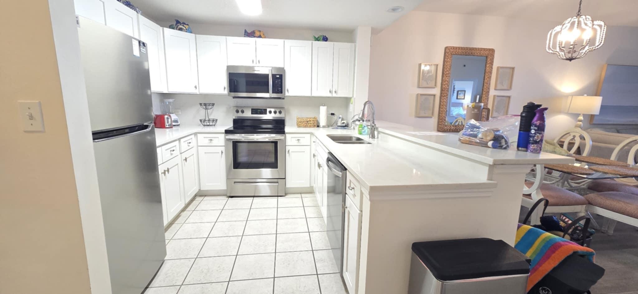 Kitchen was clean with new, updated appliances and fully stocked.