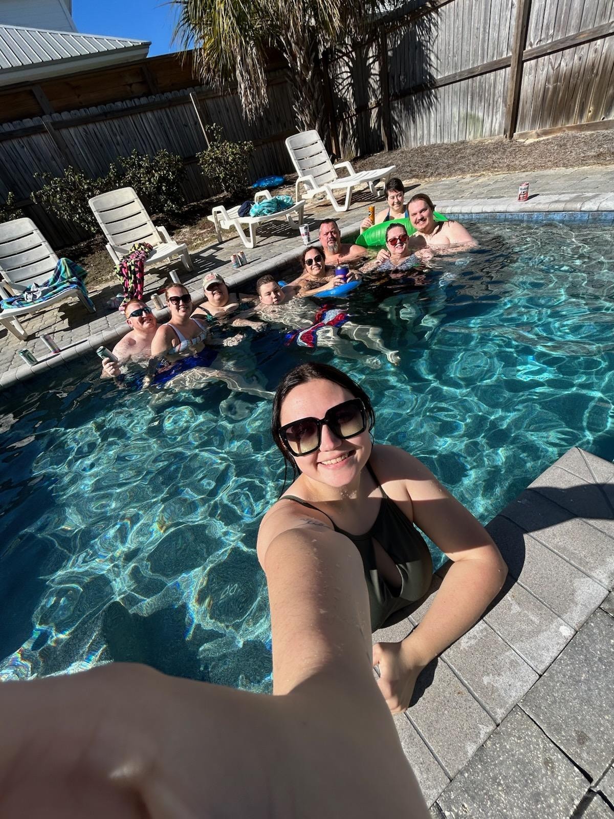 10 of our 11 family members enjoying the pool