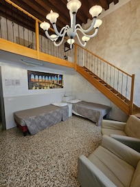 View looking up to the loft with two twin beds