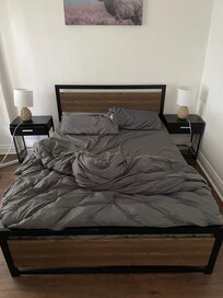 Bedroom 1 with unmade slept in bed