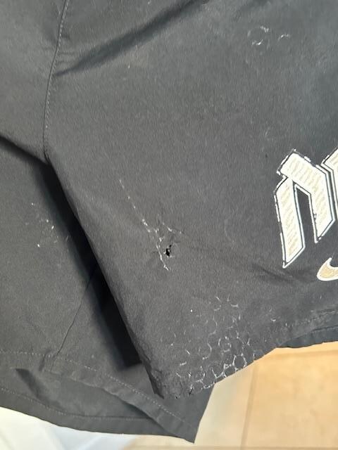 Burned hole in shorts. 