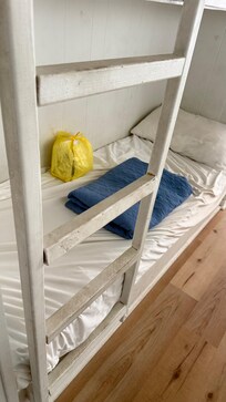 Dirt coating the bunk bed steps and walls