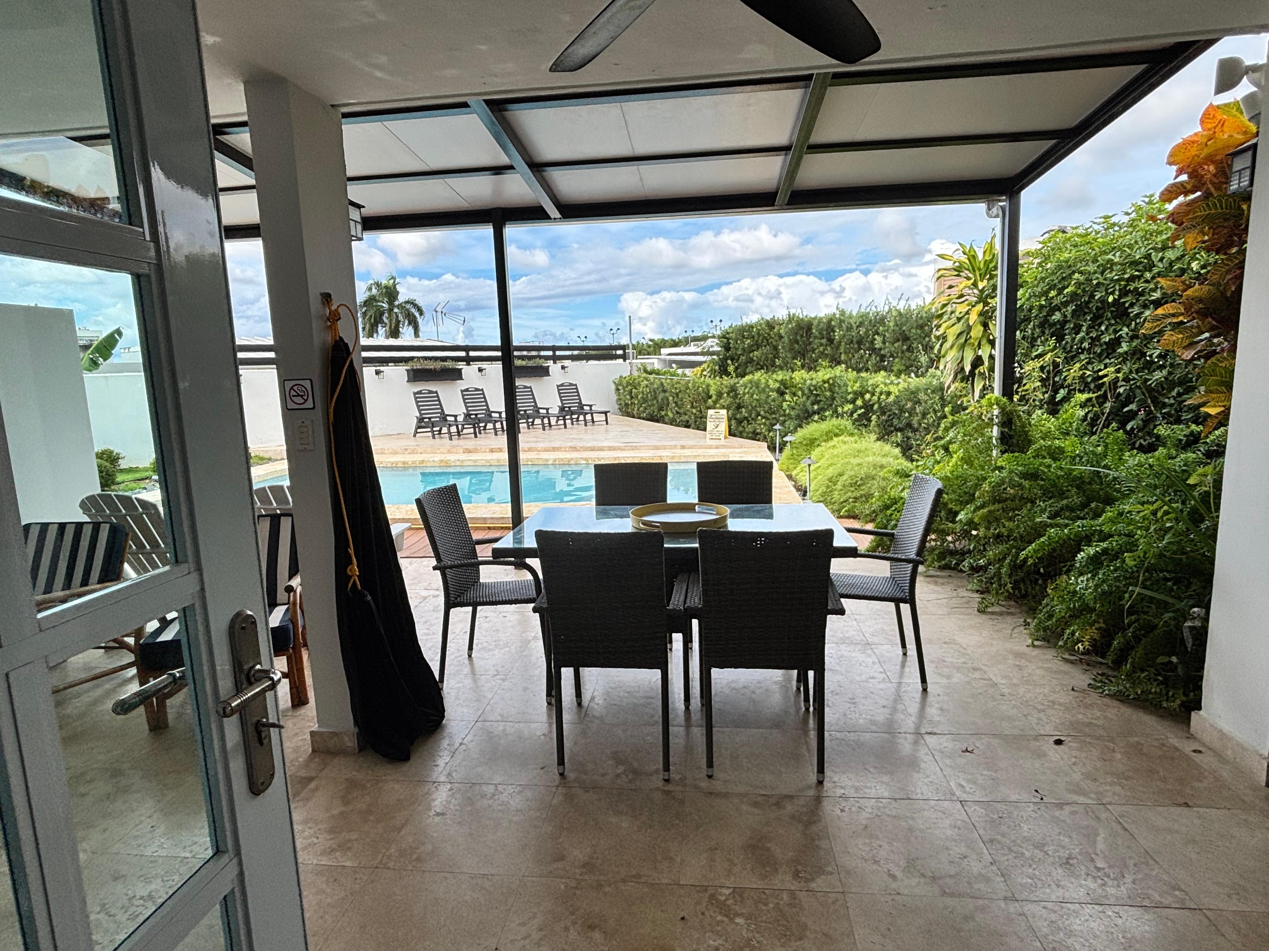 Spacious back patio area with pool and a hammock that the kids loved.