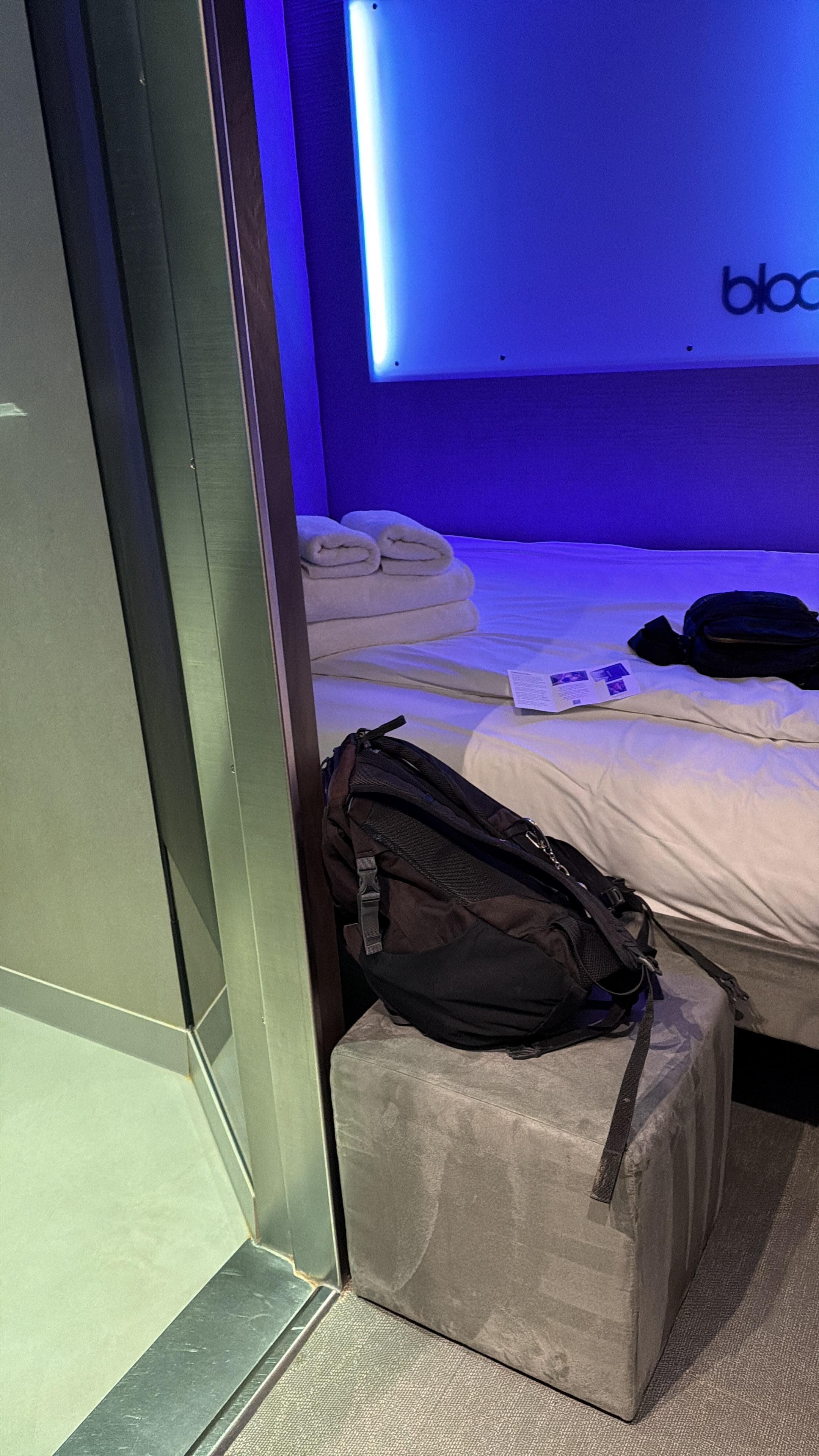 Standing by suitcase. Floor space outside bathroom about 2m x 1m 