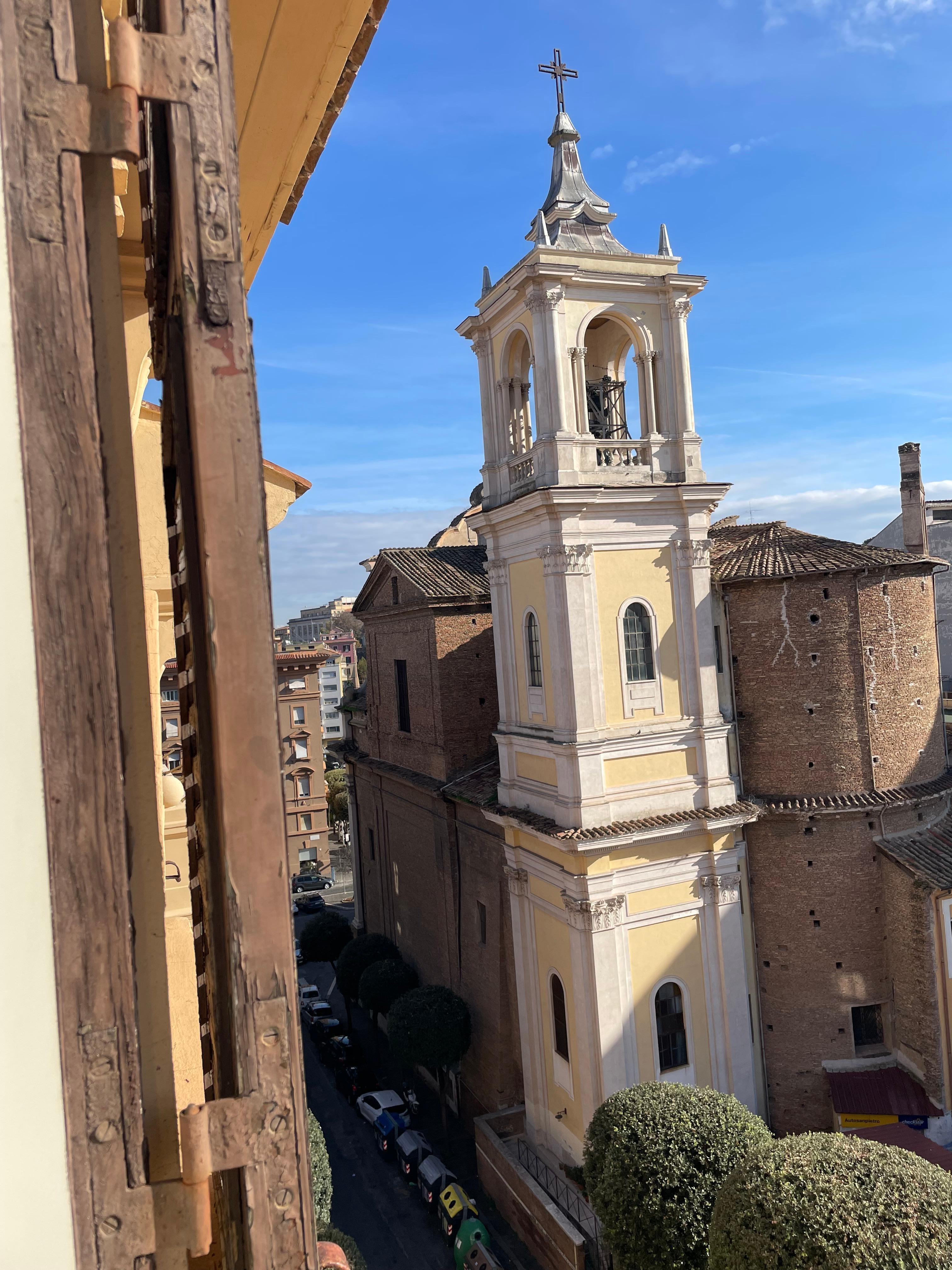 Church bell tower across the street