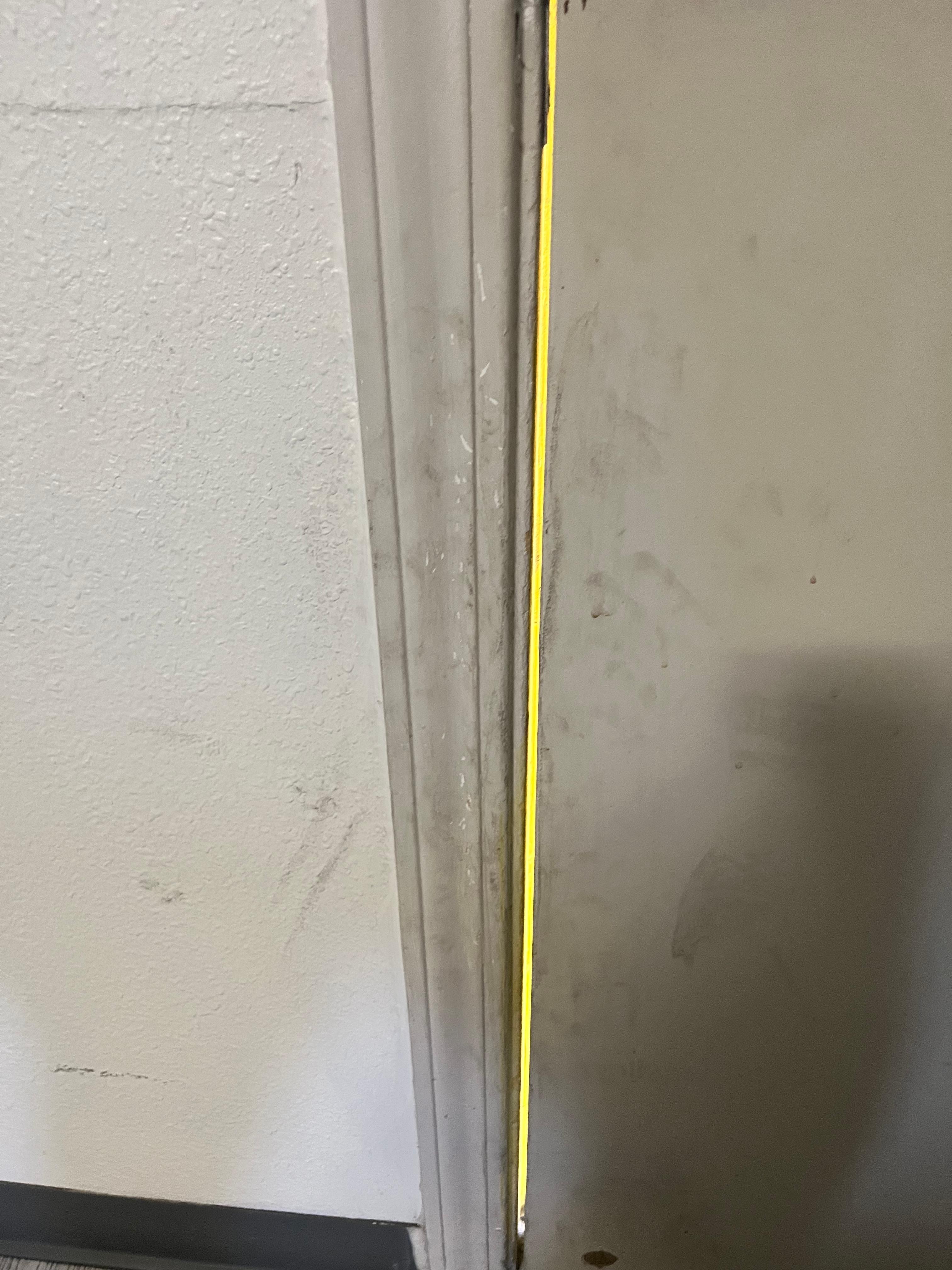 Sounds, wind coming through door jamb. Grime all around