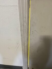 Sounds, wind coming through door jamb. Grime all around