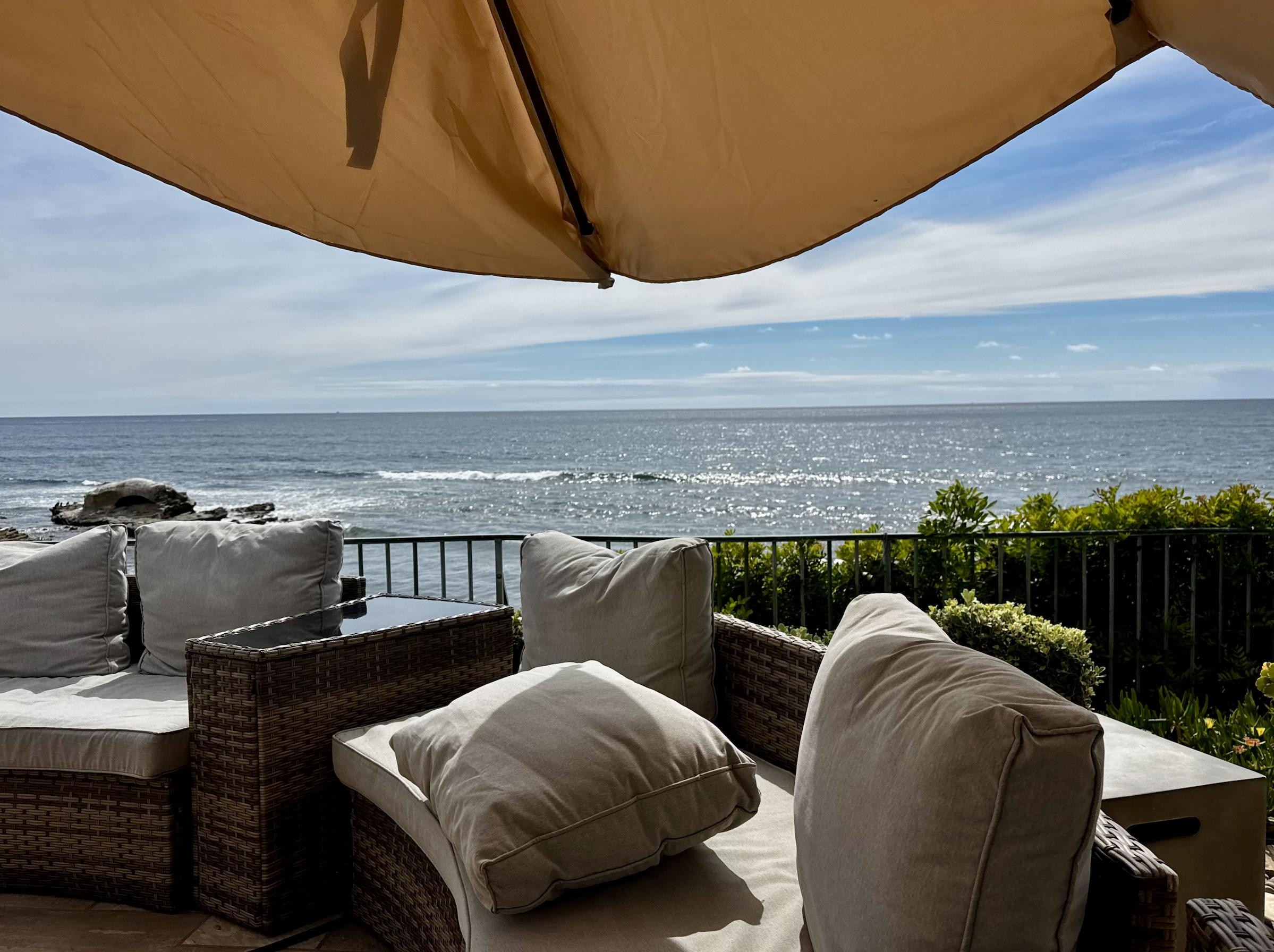 Huge umbrella that is easily moved around to provide shade on the patio