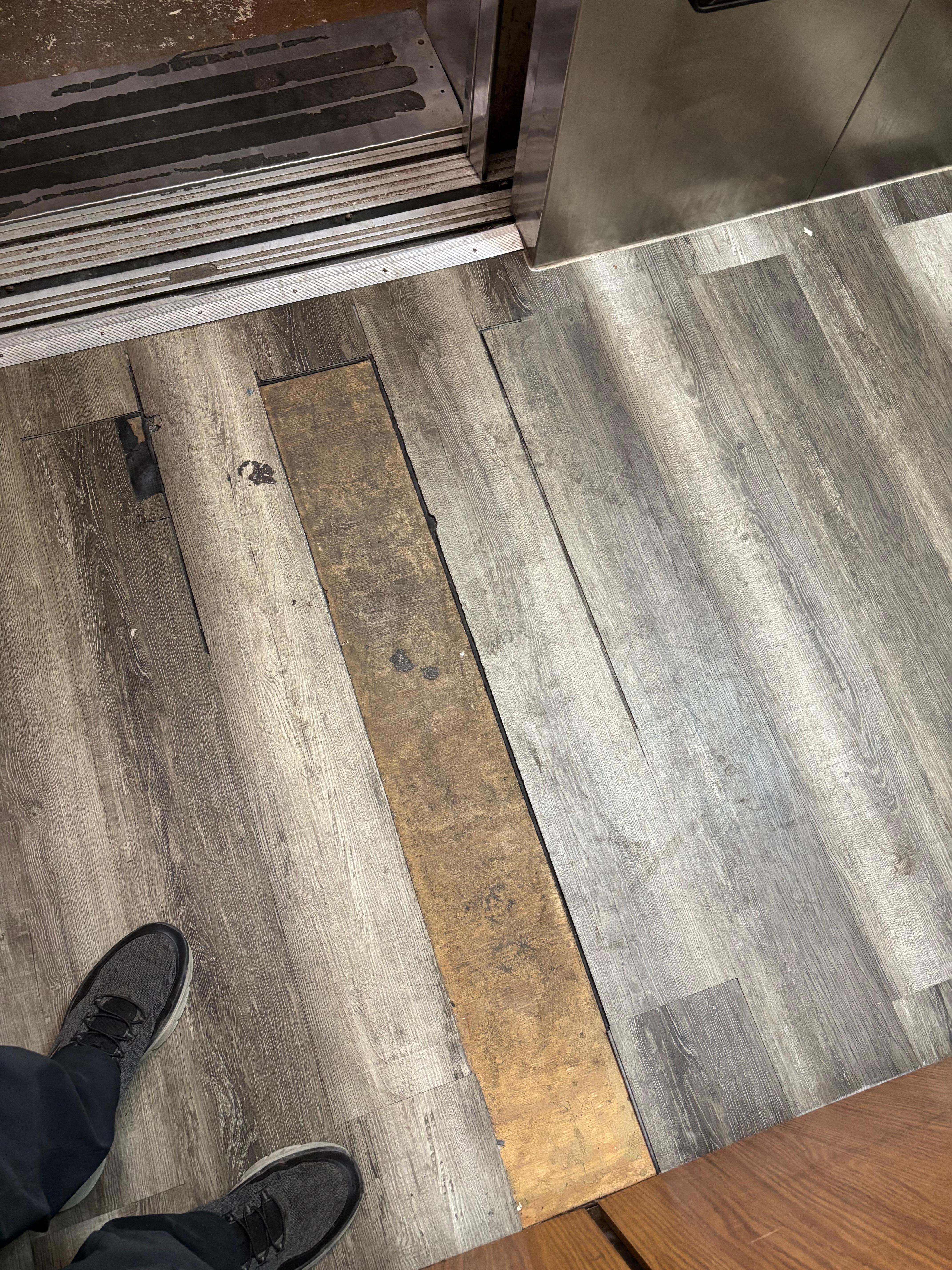 Tile missing in the elevator. 
